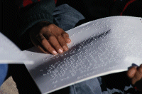 A person reading braille.
